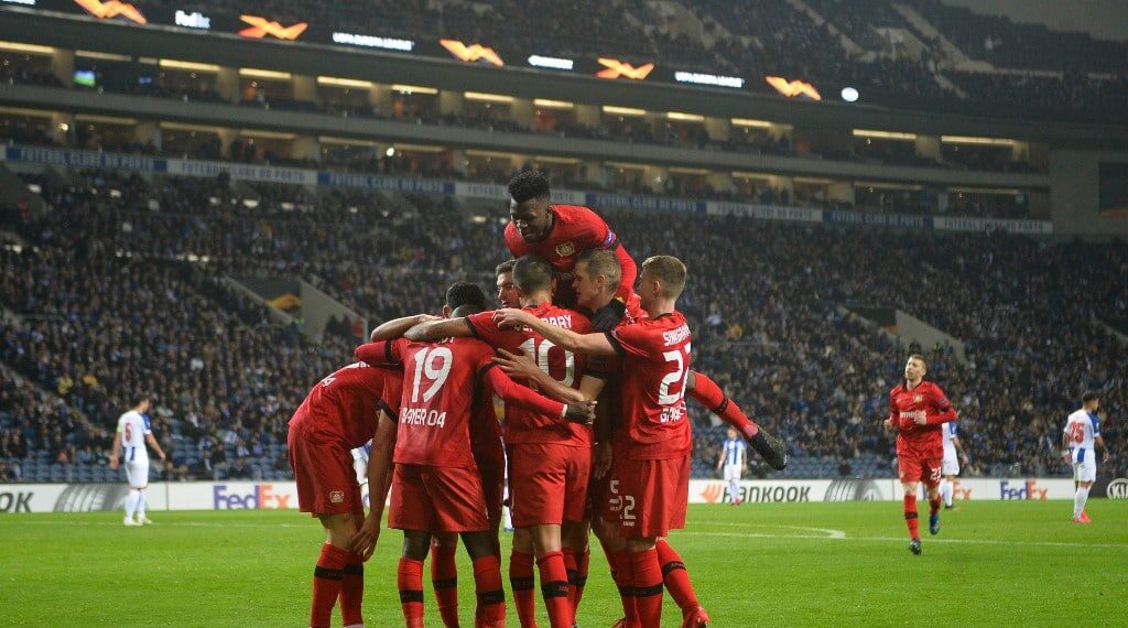 Bayer Leverkusen's payers celebrate after scoring their third goal during the UEFA Europa League round of 32 second leg football match between FC Porto and Bayer Leverkusen at the Dragao stadium in Porto on February 27, 2020. (Photo by MIGUEL RIOPA / AFP)