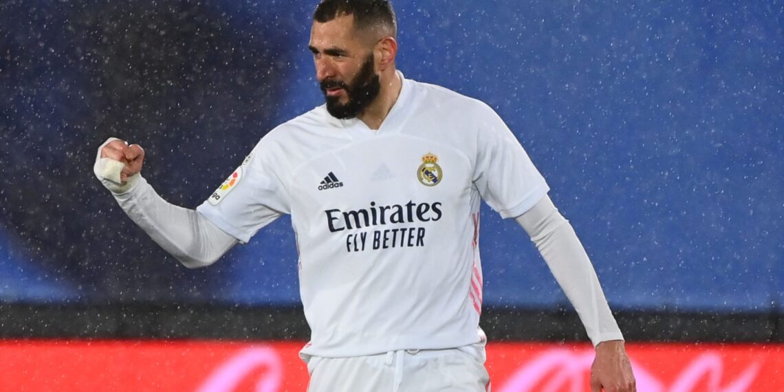 Real Madrid's French forward Karim Benzema celebrates after scoring a goal during the Spanish league football match between Real Madrid CF and Getafe CF at the Alfredo di Stefano stadium in Valdebebas, on the outskirts of Madrid on February 9, 2021. (Photo by GABRIEL BOUYS / AFP) (Photo by GABRIEL BOUYS/AFP via Getty Images)
