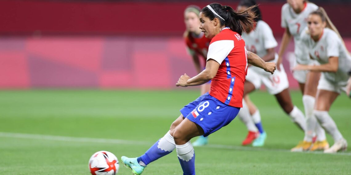SAPPORO, JAPAN - JULY 24: Karen Araya #8 of Team Chile scores their side's first goal from the penalty spot during the Women's First Round Group E match between Chile and Canada on day one of the Tokyo 2020 Olympic Games at Sapporo Dome on July 24, 2021 in Sapporo, Hokkaido, Japan. (Photo by Masashi Hara/Getty Images)