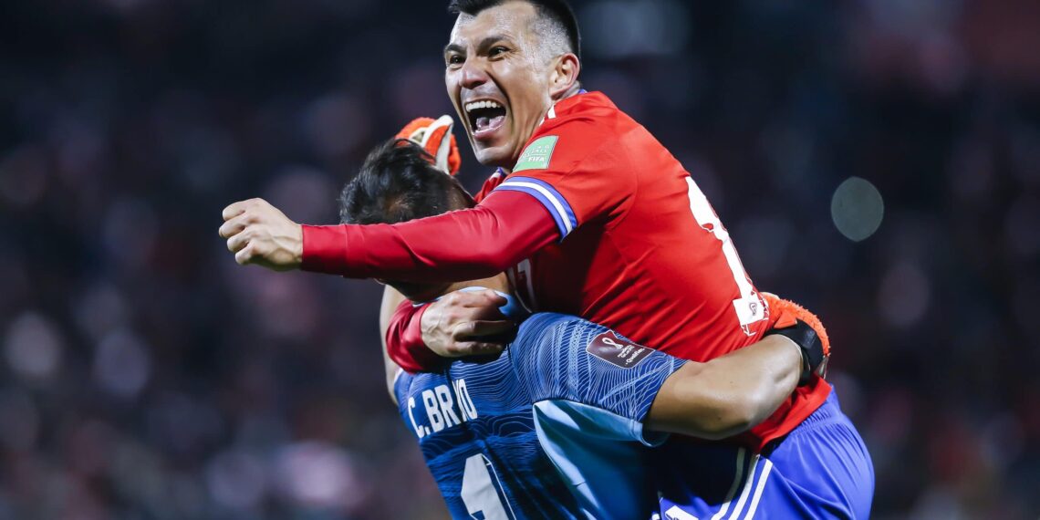SANTIAGO, CHILE - OCTOBER 14: Claudio Bravo and Gary Medel of Chile celebrate their team's third goal during a match between Chile and Venezuela as part of South American Qualifiers for Qatar 2022 at Estadio San Carlos de Apoquindo on October 14, 2021 in Santiago, Chile. (Photo by Claudio Reyes - Pool/Getty Images)