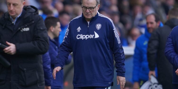 Leeds United's Argentinian head coach Marcelo Bielsa reacts as he leaves after the English Premier League football match between Leeds United and Tottenham Hotspur at Elland Road in Leeds, northern England on February 26, 2022. - Spurs won the game 4-0. - RESTRICTED TO EDITORIAL USE. No use with unauthorized audio, video, data, fixture lists, club/league logos or 'live' services. Online in-match use limited to 120 images. An additional 40 images may be used in extra time. No video emulation. Social media in-match use limited to 120 images. An additional 40 images may be used in extra time. No use in betting publications, games or single club/league/player publications. (Photo by Jon Super / AFP) / RESTRICTED TO EDITORIAL USE. No use with unauthorized audio, video, data, fixture lists, club/league logos or 'live' services. Online in-match use limited to 120 images. An additional 40 images may be used in extra time. No video emulation. Social media in-match use limited to 120 images. An additional 40 images may be used in extra time. No use in betting publications, games or single club/league/player publications. / RESTRICTED TO EDITORIAL USE. No use with unauthorized audio, video, data, fixture lists, club/league logos or 'live' services. Online in-match use limited to 120 images. An additional 40 images may be used in extra time. No video emulation. Social media in-match use limited to 120 images. An additional 40 images may be used in extra time. No use in betting publications, games or single club/league/player publications. (Photo by JON SUPER/AFP via Getty Images)