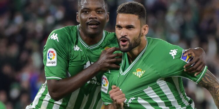 Real Betis' Brazilian midfielder Willian Jose (R) celebrates with teammate Real Betis' Portuguese midfielder William Carvalho after scoring a goal during the Spanish league football match between Real Betis and RCD Mallorca at the Benito Villamarin stadium in Seville on February 20, 2022. (Photo by CRISTINA QUICLER / AFP) (Photo by CRISTINA QUICLER/AFP via Getty Images)