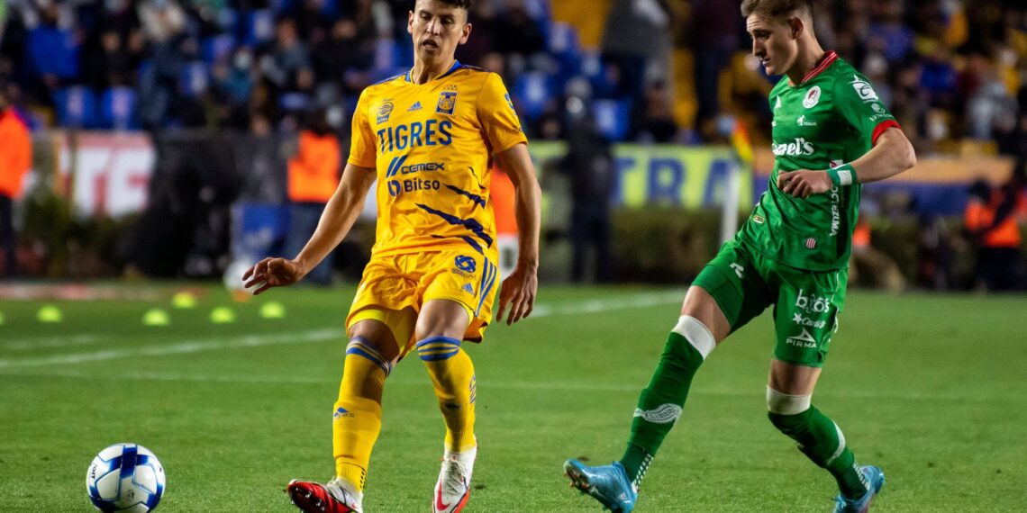 Igor Lichnovsky (L) of Tigres vies for the ball with Ramon Juarez (R) of San Luis during their Mexican Clausura 2022 tournament football match at Universitario Stadium in Monterrey, Mexico, on February 19, 2022. (Photo by Julio Cesar AGUILAR / AFP) (Photo by JULIO CESAR AGUILAR/AFP via Getty Images)
