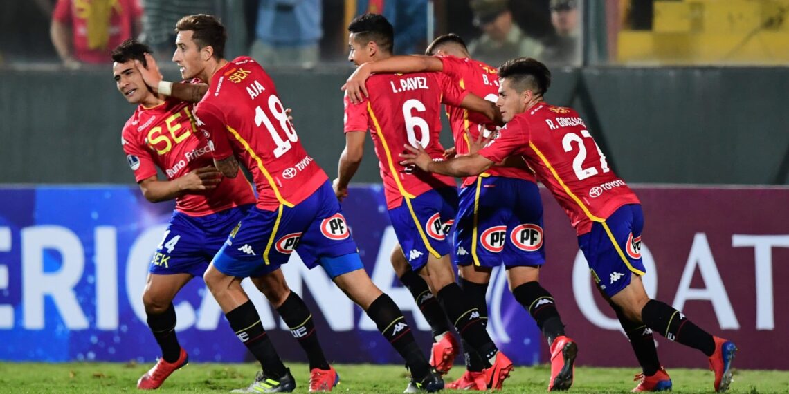 David Llanos (L) of Chile's Union Espanola celebrates with Jose Aja (2nd L) and teammates after scoring against Ecuador's Mushuc Runa during their Copa Sudamericana football match at the Santa Laura stadium in Santiago, Chile, on March 19, 2019. (Photo by MARTIN BERNETTI / AFP)        (Photo credit should read MARTIN BERNETTI/AFP via Getty Images)