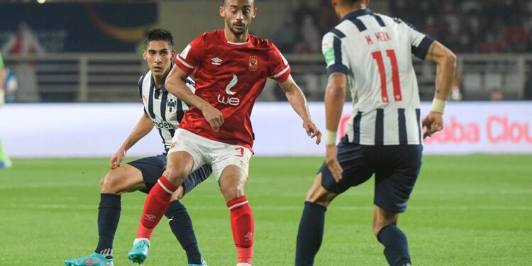 Ahly's midfielder Ahmed Abd Elkader (C) vies for the ball with Monterrey's forward Maximiliano Meza during the 2021 FIFA Club World Cup football match between Egypt's Al-Ahly and Mexico's Monterrey at al-Nahyan Stadium in Abu Dhabi, on February 5, 2022. (Photo by AFP) (Photo by -/AFP via Getty Images)