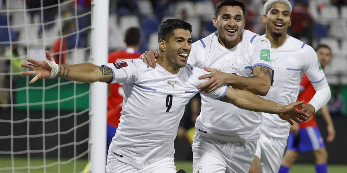 SANTIAGO, CHILE - MARCH 29: Luis Suarez of Uruguay celebrates after scoring the first goal of his team during the FIFA World Cup Qatar 2022 qualification match between Chile and Uruguay ay Estadio San Carlos de Apoquindo on March 29, 2022 in Santiago, Chile. (Photo by Alberto Valdez - Pool/Getty Images)