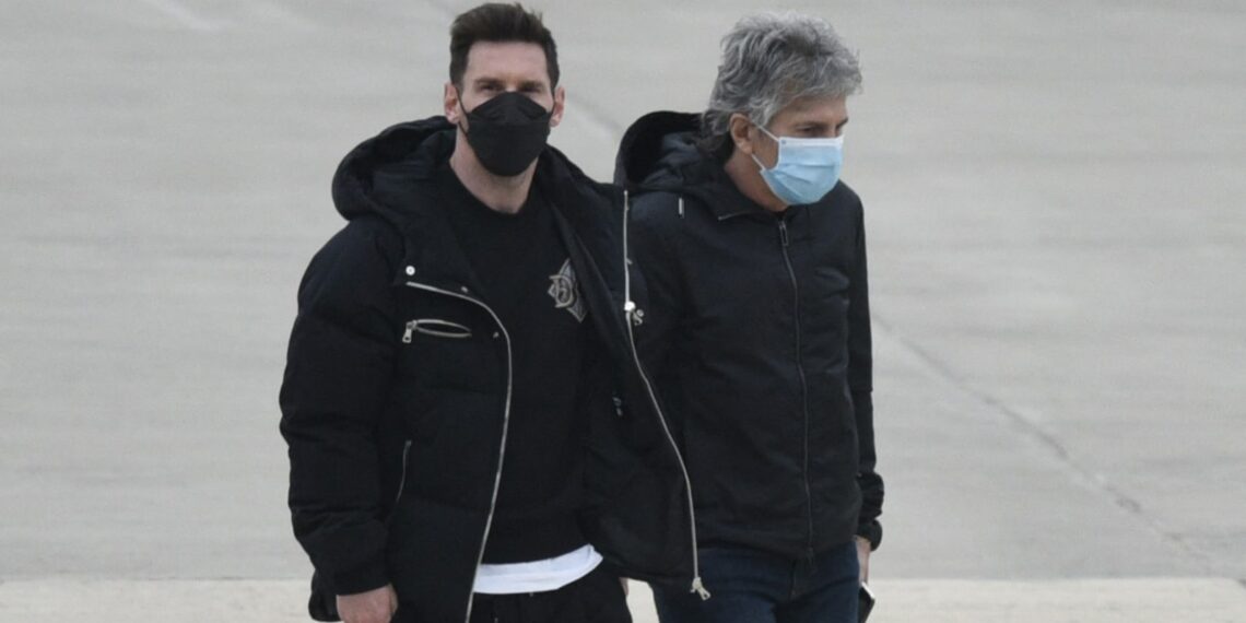 Argentina's football player Lionel Messi (L) and his father Jorge Messi (R) arrive at the Islas Malvinas airport in Rosario, Santa Fe province, Argentina, on July 13, 2021, after making his visa arrangements in the US Embassy to travel to Miami on vacation. (Photo by STR / AFP) (Photo by STR/AFP via Getty Images)
