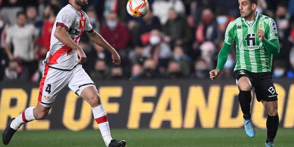 Rayo Vallecano's Spanish midfielder Mario Suarez (L) fights for the ball with Real Betis' Spanish forward Juanmi during the Spanish Copa del Rey (King's Cup) semi-final football match between Rayo Vallecano de Madrid and Real Betis at the Vallecas stadium in Madrid, on February 9, 2022. (Photo by OSCAR DEL POZO / AFP) (Photo by OSCAR DEL POZO/AFP via Getty Images)