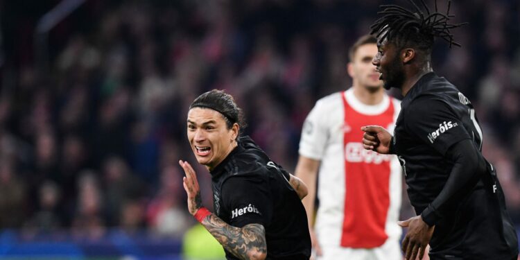 Benfica's Uruguayan forward Darwin Nunez (C) celebrates after opening the scoring during the UEFA Champions League round of 16 second leg football match between Ajax and Benfica at the Johan Cruijff ArenA, in Amsterdam, on March 15, 2022. (Photo by JOHN THYS / AFP) (Photo by JOHN THYS/AFP via Getty Images)
