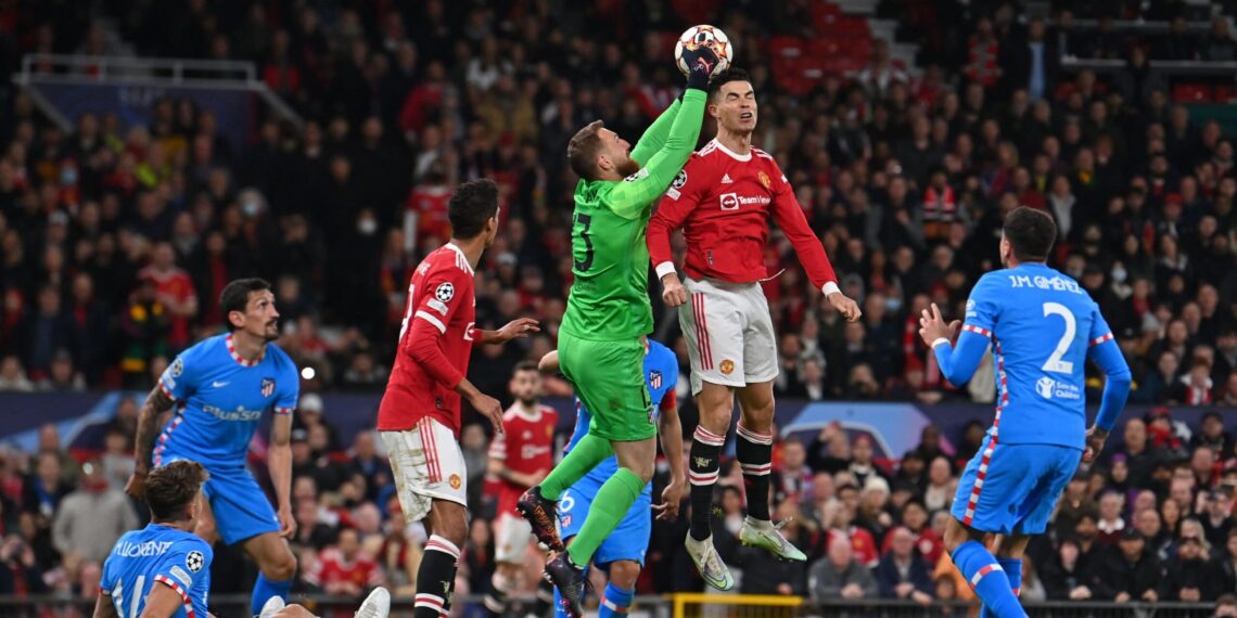 Manchester United's Portuguese striker Cristiano Ronaldo (2nd R) vies with Atletico Madrid's Slovenian goalkeeper Jan Oblak (C) during the UEFA Champions League round of 16 second leg football match between Manchester United and Atletico Madrid at Old Trafford stadium in Manchester, north west England on March 15, 2022. (Photo by Paul ELLIS / AFP) (Photo by PAUL ELLIS/AFP via Getty Images)