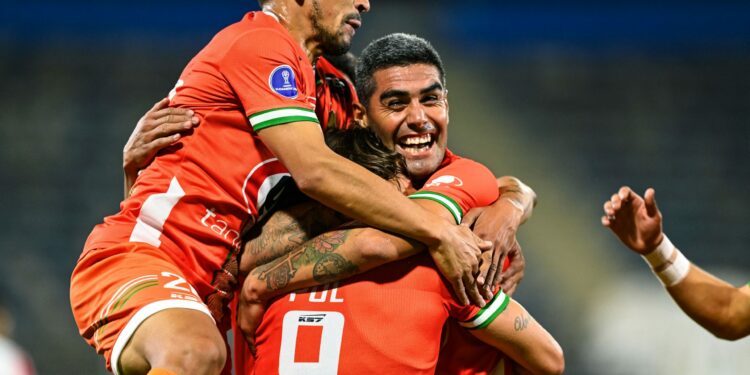 Cobresal's Argentine Marcos Pol (C) celebrates with teammates after scoring a goal during the Copa Sudamericana football tournament all-Chilean first round match against Palestino at the San Carlos de Apoquindo Stadium in Santiago on April 8, 2021. (Photo by MARTIN BERNETTI / AFP) (Photo by MARTIN BERNETTI/AFP via Getty Images)