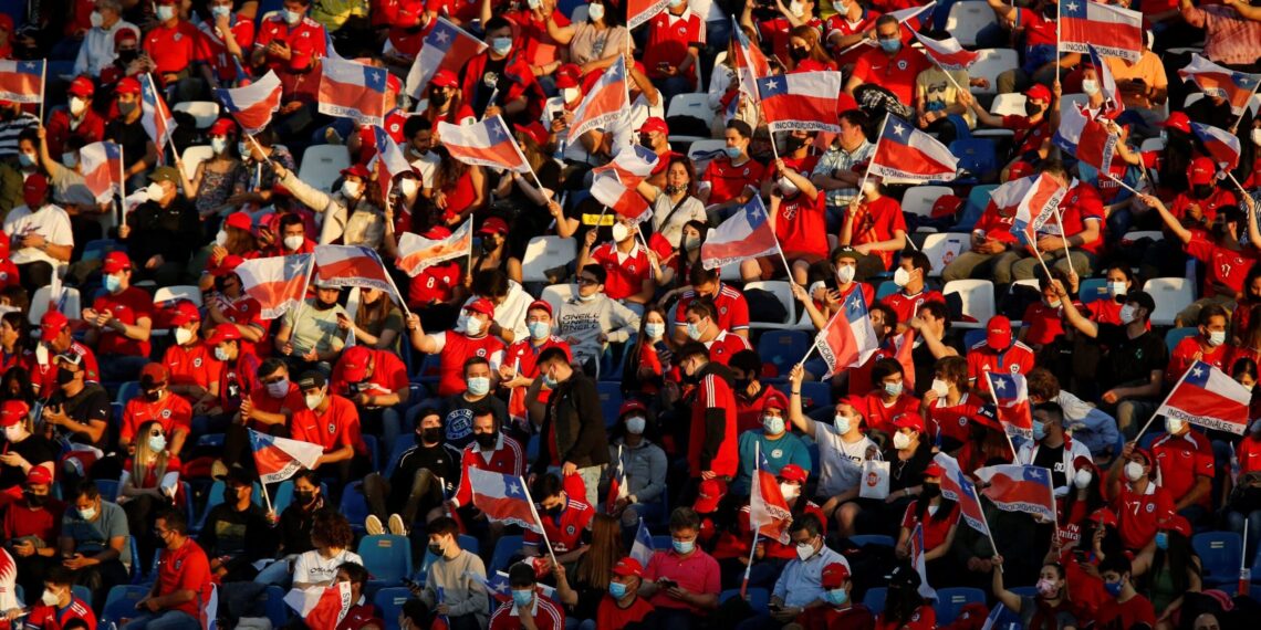 Fans of Chile wait for the start of the South American qualification football match for the FIFA World Cup Qatar 2022 against Ecuador, at the San Carlos de Apoquindo stadium in Santiago, on November 16, 2021. (Photo by Marcelo HERNANDEZ / POOL / AFP) (Photo by MARCELO HERNANDEZ/POOL/AFP via Getty Images)