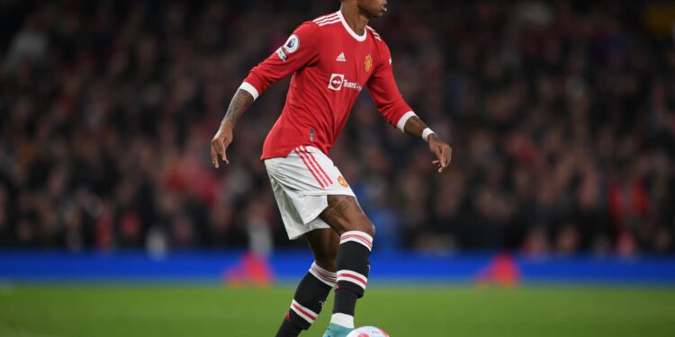 MANCHESTER, ENGLAND - MARCH 12: Marcus Rashford of Manchester United in action during the Premier League match between Manchester United and Tottenham Hotspur at Old Trafford on March 12, 2022 in Manchester, England. (Photo by Michael Regan/Getty Images)