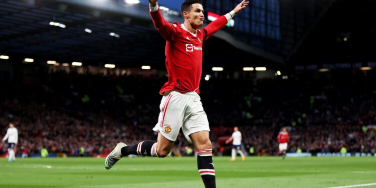 MANCHESTER, ENGLAND - MARCH 12: Cristiano Ronaldo of Manchester United celebrates after scoring their side's second goal during the Premier League match between Manchester United and Tottenham Hotspur at Old Trafford on March 12, 2022 in Manchester, England. (Photo by Naomi Baker/Getty Images)