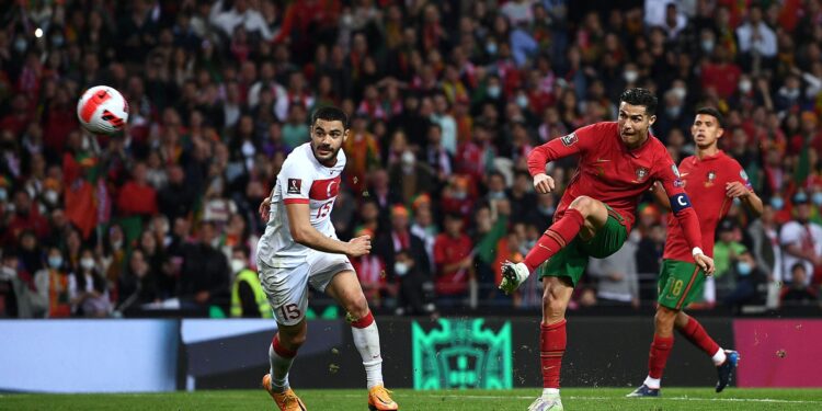 PORTO, PORTUGAL - MARCH 24:  Cristiano Ronaldo of Portugal takes a shot during the 2022 FIFA World Cup Qualifier knockout round play-off match between Portugal and Turkey at Estadio do Dragao on March 24, 2022 in Porto, Porto. (Photo by Octavio Passos/Getty Images)
