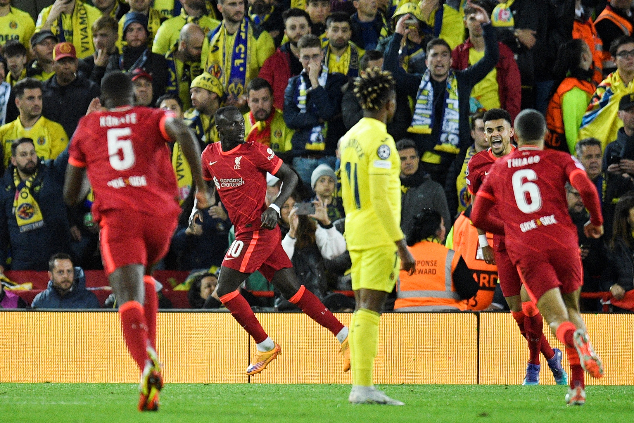 Liverpool's Senegalese striker Sadio Mane celebrates after scoring his team second goal during the UEFA Champions League semi-final first leg football match between Liverpool and Villarreal, at the Anfield Stadium, in Liverpool, on April 27, 2022. (Photo by Oli SCARFF / AFP) (Photo by OLI SCARFF/AFP via Getty Images)