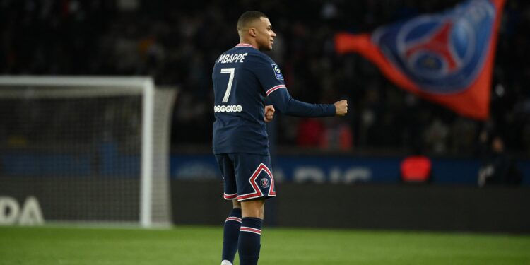 Paris Saint-Germain's French forward Kylian Mbappe celebrates after scoring the 3-1 goal during the French L1 football match between Paris Saint-Germain (PSG) and FC Lorient at the Parc des Princes stadium in Paris on April 3, 2022. (Photo by FRANCK FIFE / AFP) (Photo by FRANCK FIFE/AFP via Getty Images)