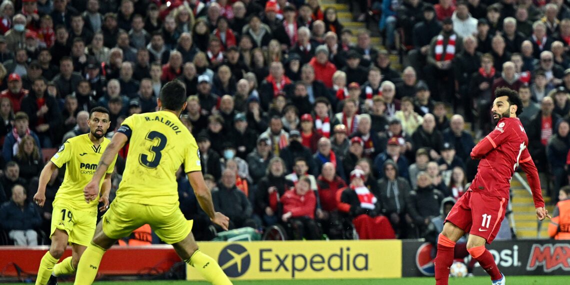 Liverpool's Egyptian midfielder Mohamed Salah shoots the ball during the UEFA Champions League semi-final first leg football match between Liverpool and Villarreal, at the Anfield Stadium, in Liverpool, on April 27, 2022. (Photo by Oli SCARFF / AFP) (Photo by OLI SCARFF/AFP via Getty Images)