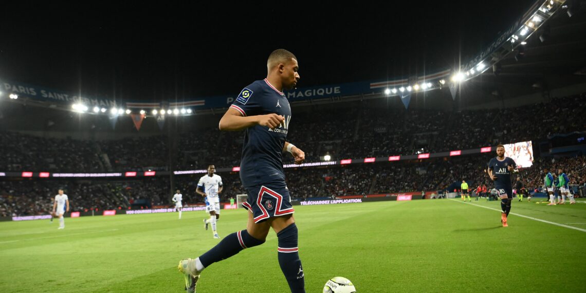 Paris Saint-Germain's French forward Kylian Mbappe runs with the ball during the French L1 football match between Paris-Saint Germain (PSG) and ES Troyes AC at The Parc des Princes Stadium in Paris on May 8, 2022. (Photo by FRANCK FIFE / AFP) (Photo by FRANCK FIFE/AFP via Getty Images)