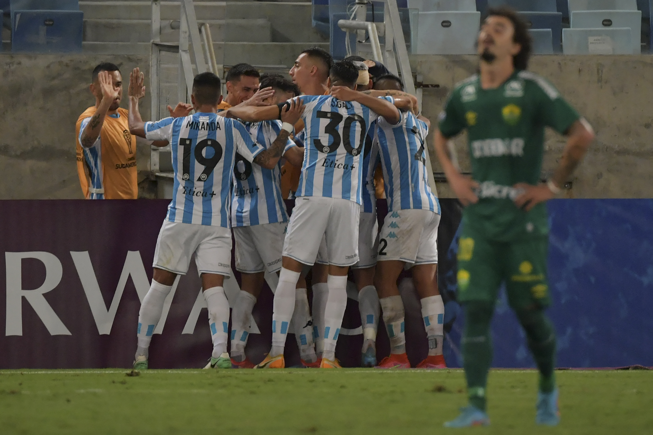 Argentina's Racing players celebrate after scoring against Brazil's Cuiaba during the Copa Sudamericana group stage football match at the Pantanal Arena in Cuiaba, Brazil, on May 3, 2022. (Photo by NELSON ALMEIDA / AFP) (Photo by NELSON ALMEIDA/AFP via Getty Images)