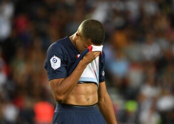 Paris Saint-Germain's French forward Kylian Mbappe reacts after missing to score on a penalty kick during the French L1 football match between Paris-Saint Germain (PSG) and Montpellier Herault SC at The Parc des Princes Stadium in Paris on August 13, 2022. (Photo by EMMANUEL DUNAND / AFP) (Photo by EMMANUEL DUNAND/AFP via Getty Images)